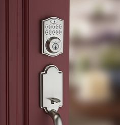 an electronic door lock on a red door