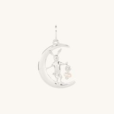 A little bunny surfs a crescent moon — with a pearl lantern to light the way. Designed by Laufey and Catbird. “My earliest memory of jewelry is…I think, when I was born, I’m born the year of the rabbit in the Chinese zodiac. So when I was born, I was given a lot of little rabbit jewelry and little gold rabbits.” — Laufey Made with 100% sterling silver. Each charm comes with a Laufey x Catbird keepsake ribbon. Rings to turn melancholy into joy, tiny gold bunnies, hearts for Lauvers, jewelry for dreamers. Presenting a limited edition collection made with Laufey, who sets the intimacy of connection and a winding inner life against the grandeur of an orchestra. We admire Laufey for breaking rules gently, and for forging her own iconoclastic path. Chocolate Caviar, Elegant Silver Moon Charm, Dainty Blue Moon Charm Jewelry, Silver Bunny Design Jewelry Gift, Russ And Daughters, Bunny Pendant Necklace, Catbird Jewelry, The Year Of The Rabbit, Rabbit Jewelry