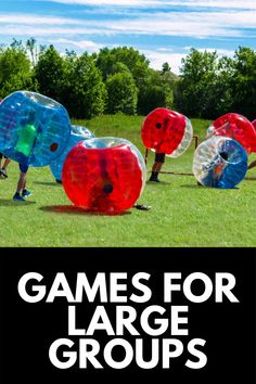 several people are playing with large inflatable balls on the grass and text reads games for large groups