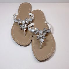 Rhinestone Flat, Flip Flop, Jeweled Sandals. Never Worn. White Synthetic Sandals With Rhinestones, White Open Toe Sandals With Rhinestones, White Rhinestone Open Toe Sandals, Embellished White Synthetic Sandals, White Rhinestones Open Toe Sandals, White Embellished Open Toe Sandals, Spring Embellished White Sandals, White Flat Embellished Sandals, White Embellished Flat Sandals