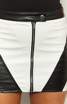 * Black and White PU Mini Skirt 
 * 
 
 * HOW TO STYLE: 
 * Look fierce and bold in our edgy contrast mini skirt (), perfect for your next festival (). Let this piece be the centre of attention with a white top () and black boots. 
 * 
 
 * FEATURES: 
 * Low waist style 
 * Mini length 
 * Mid-weight PU material 
 * Button closure at waist 
 * Centre front zip 
 * Slight stretch Chic Fitted Color Block Skirt, Fitted Color Block Mini Skirt, Color Block Fitted Mini Skirt, Low Waist Mini Skirt, Prom Midi Dress, 60's Dress, Summer Playsuit, Semi Formal Dresses, Strapless Tops