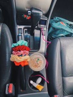 the interior of a car with various items in it, including an air freshener dispenser