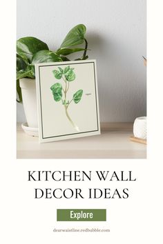 the kitchen wall decor idea is displayed next to a potted plant on a table