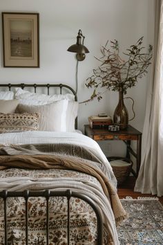 a bedroom with a bed, lamp and rug