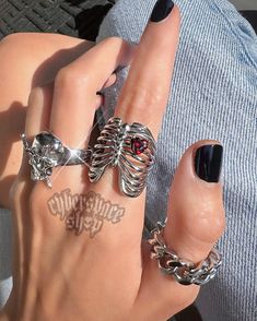 🩻 Ribcage Ring ❤️ Features a red heart shaped cubic zirconia stone ⛓ 100% solid 316L stainless steel 💦 Waterproof 👽 NO green skin. NO tarnish. NO rust 🖐 Sizes 5-11 available Punk Stainless Steel Jewelry With Metal Ring, Punk Style Stainless Steel Metal Ring Jewelry, Gothic Stainless Steel Metal Ring Jewelry, Valentine's Day Metal Ring Jewelry, Silver Heart-shaped Punk Jewelry, Silver Punk Jewelry For Valentine's Day, Punk Silver Jewelry For Valentine's Day, Heart Shaped Metal Rings For Valentine's Day, Heart-shaped Metal Rings For Valentine's Day