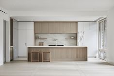 the kitchen is clean and ready to be used as a living room or dining area