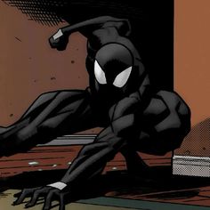 a black spider - man standing on one leg in front of an open door with his arms stretched out