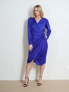 "Vintage 80s Blue Draped Dress - Zips up the back - Plunging V neckline -Measurements- Estimated Size: Small Bust: 34-35\" Waist : 26\" Hips: 38\" Length: 40\" Sleeve: 25\" Model is 5'9 and measures 32/25/34" Blue Midi Dress With Surplice Neckline For Parties, Blue Midi Dress With Surplice Neckline For Evening, Blue Surplice Neckline Midi Dress For Party, Blue Surplice Neckline Midi Dress For Evening, Blue Dress With Surplice Neckline For Evening, Blue Evening Dress With Surplice Neckline, Blue Draped Midi Dress For Party, Blue Draped Dinner Dress, Blue Draped Dress For Dinner