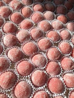 some sugar balls are sitting on top of each other in the middle of a table