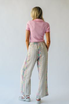 Introducing the Feia Embroidered Pant, perfect for adding some quirky style to your wardrobe. With colorful embroidery and a cream base, these pants are sure to make a statement. Step out in style while staying comfortable and unique. Details self: 61% acrylic + 22% polyester + 17% viscose lining: 100% cotton Fabric Care Guide Here Sizing & Fit Measurements are approximate and taken while laying flat across the front. Not doubled. small: waist = 15"; length = 42" ; inseam= 30" medium: waist = 15