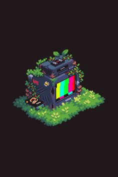 an old tv sitting on top of a lush green field in front of a black background