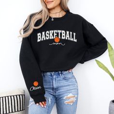 Customize this basketball mom sweatshirt with your child's name for the perfect game day outfit to wear to the court! Made with comfortable materials, this personalized basketball mama sweater is ideal for cozy and stylish everyday wear. Information - Gildan 18000 Unisex Sweatshirt - 50% Cotton 50% Polyester - Ribbed knit collar - Printed with the highest quality and durability Care Instructions - Machine wash: warm (max 40C or 105F) - Non-chlorine bleach - Tumble dry on low or lay flat to dry - Glitter Basketball, Mama Pullover, Customized Basketball, Basketball Mom Shirts, Basketball Sweatshirts, Mama Sweater, Personalized Basketball, Sister Tshirts, Basketball Gifts