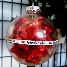 a glass ornament with red candies in it and a ribbon that says i can't remember what i have today