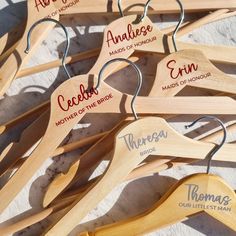 wooden clothes hangers with names on them