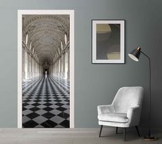 an open door with a black and white checkerboard pattern on the floor next to a chair