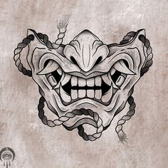 a drawing of a demon mask on a wall