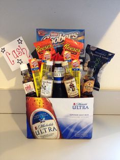 a gift basket filled with alcohol and snacks