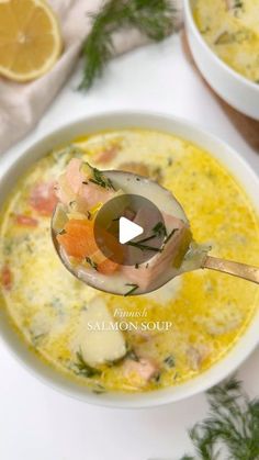 a spoonful of salmon soup with lemons and dill