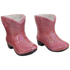 pair of pink cowboy boots sitting next to each other