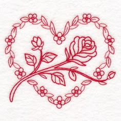 a heart shaped embroidered with flowers and leaves