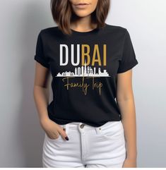 Commemorate your Dubai family adventure with our stylish Dubai trip shirt! Comfortable and trendy, it's a perfect wearable souvenir for your memorable journey. Grab yours now and make it a trip to remember! Made from very soft materials, this tee is 100% cotton for solid colors. The shoulders have twill tape for improved durability. There are no side seams. The collar is made with ribbed knitting to prevent curling damage.  - Made with 100% cotton for solid colors, a lightweight fabric (4.5 oz/y Family Matching Tops With Letter Print, Cotton Short Sleeve T-shirt For Family Trip, Family Matching Short Sleeve Tops For Family Trip, Graphic Print Top For Summer Family Trip, Summer Letter Print Tops For Family Trip, Casual Black Top For Travel, Graphic Print Summer Top For Family Trip, Summer Graphic Print Top For Family Trip, Casual Summer Tops For Family Trip