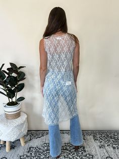 Channel your inner free spirit with Wanderlust, the perfect travel companion. This floral lace tunic is a versatile piece that can be worn as a bathing suit cover up or layered with a tank, tube top, bike shorts, or jeans. With a scallop edge detail and a beige hue, it's both feminine and functional. 60% Nylon 40% Cotton. Besties: LBD, Tubin, Biking Day Trip, Cupid's Dart Wicked, Reverse It, Biking, True Love, Overcast Chic Stretch Lace Top For Summer, Chic Summer Lace Top For Layering, Chic Summer Lace Top With Delicate Details, Chic Lace Top For Summer Layering, Fitted Lace Crop Top For Summer, Chic Delicate Lace Summer Top, Stretch Cover-up For Summer Festivals, Beachy Stretch Sleeveless Cover-up, Summer Stretch Lace Top