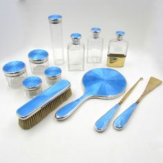 an assortment of bathroom items on a white surface