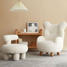 a white chair and foot stool in a room