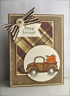 a close up of a card with a truck and pumpkins on the front side