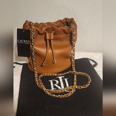 Chain Crossbody Strap With A 14" Drop Length. Drawstring Cinches At The Front. Magnetic Snapped Closure. “Lauren Ralph Lauren”Debossed Logo. Zip Pocket And Slip Pocket At The Interior. 7.5" H X 7.25" L X 4.5" D. Weighs Approximately 1 Lb., 4.25 Oz. Lining Is Made With Polyester And Recycled Polyester. Shell: Leather. Lining: Polyester. Clean By A Leather Specialist. Imported. Includes A Dust Bag. Ralph Lauren Bags, Brown Crossbody Bag, Ralph Lauren Leather, Brown Crossbody, Black Cross Body Bag, Green Leather, Crossbody Strap, Lauren Ralph Lauren, Crossbody Shoulder Bag