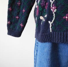 Vintage 1980s / 1990s Embroidered Sweater. Lovely pullover hand embroidered sweater with roses and vines. DETAILS - Brand: Christopher & Banks - Label Size: small - Color: navy blue, green, purple - Material: 55% ramie 45% cotton - hand embroidery - pullover style - small shoulder pads - long sleeves - minimal stretch knit - Note on condition: minimal pilling in fabric MEASUREMENTS (inches / centimers) - Length: 25 / 63.5 - Shoulders: 20 / 50.8 - Waist: 38 / 96.52 - Bust: 38 / 96.52 - Hip: 3 Embroidered Sweater Vintage, Hand Embroidered Sweater, High Waisted Mom Jeans, Vintage Leather Jacket, Embroidered Sweater, Sweater Vintage, Pullover Sweater Women, Red T, Knit Pullover