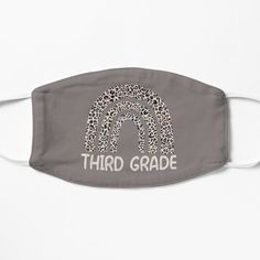 a gray face mask with the words third grade printed on it and leopard print in white