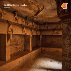 the interior of a cave with carved niches