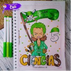 a spiral notebook with an image of the character ginga on it and three markers next to it