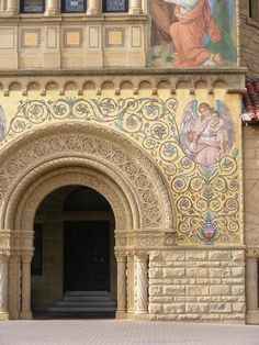 an ornate building with paintings on the side