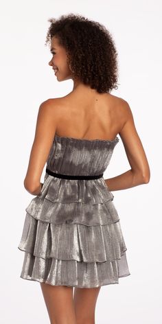 Celebrate your special day in style wearing our Strapless Organza Tiered Fit and Flare Dress. Ideal for cocktails, homecoming, wedding, holiday party or your recent RSVP! Our fit and flare silhouette flatters a range of body types, just view the details: a pleated strapless bodice with velvet waist accent, tiered organza skirt and open back. Complete this playful look with Rhinestone Satin Full Flap Handbag, Grand Fan CZ Drop Earrings, and High Heel Glitter Ankle Strap Sandals. Flirty Evening Dress With Pleated Bodice, Strapless Party Mini Dress With Pleated Bodice, Glamorous A-line Strapless Dress For Weddings, Strapless Mini Dress With Pleated Bodice For Party, Party A-line Fit And Flare Strapless Dress, Pleated Bodice Mini Dress For Prom Party, Flirty A-line Strapless Dress For Party, Fit And Flare Strapless Dress For Party, Glamorous Cocktail Strapless Dress With Pleated Bodice