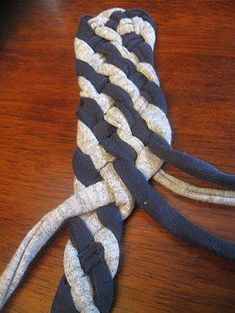 a black and white striped tie sitting on top of a wooden table