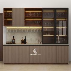 an empty bar with wine glasses and bottles on the back wall, next to a brown cabinet