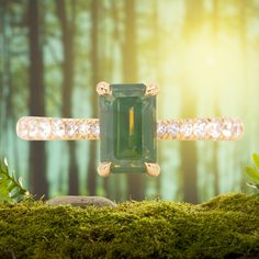 Give your style a sparkle with our Classic Prong Hidden Halo Sapphire solitaire with French Set diamond band. A 1.67ct emerald cut, opalescent green sapphire is at its center, measuring around 8x5mm. Its unique profile elevates your style and makes it easy to mix and match with similar bands. Crafted from recycled 18k yellow gold and decorated with delicate tapered, natural diamonds from 1.3mm to 2mm in size, this beauty will make a statement. Finish off your look with either a classic polished Luxury Radiant Cut May Birthstone Jewelry, Green Moissanite Jewelry In Radiant Cut, Green Moissanite Radiant Cut Jewelry, Green Moissanite Jewelry With Radiant Cut, Green Radiant Cut Moissanite Jewelry, Green Jewelry With Radiant Cut Accent Stones, Green Asscher Cut Moissanite Jewelry, Green Baguette Cut Jewelry With Accent Stones, Green Emerald Cut Diamond Gemstones