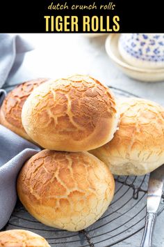 three pieces of bread sitting on top of a wire rack next to a blue and white plate