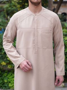 Paneled Thobe - Thobes - Men Formal Long Sleeve Tops With Buttoned Pockets, Beige Collar Tops With Pockets, Beige Long Sleeve Tops With Concealed Placket, Beige Collared Top With Pockets, Formal Collared Top With Buttoned Pockets, Thobes Men, Area Model, Retro Photoshoot, Pant Design