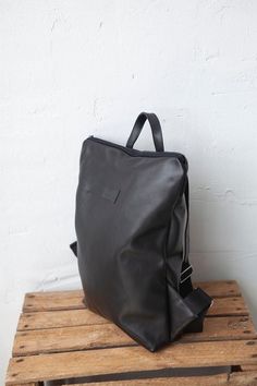 Women Backpack, Leather Backpack, Black BackpackLeather backpack is made from black leather. Zip it and you will find natural lining with open pocket inside.LeaF leather backpacks are very light and not overloads your back.Minimalist design leather backpack fits 15" laptop. |Details||MATERIAL: upcycled leather.|COLOR: black, please note, that colors may vary due to computer monitor's settings and lightening.|WIDTH: 32 cm (12.6 in). |HEIGTH: 42 cm (16.5 in). |SHIPPING: ready to ship in 1-2 days.| Leather Backpack Black, Backpack Fits, Hipster Backpack, Convertible Backpack Purse, Upcycled Bag, Backpack Gift, Minimalist Backpack, Upcycled Leather, Leather Backpacks