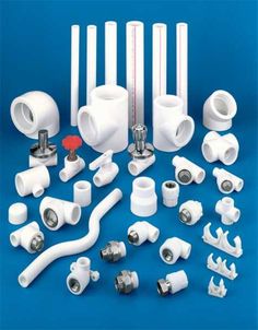 various white pipes and fittings on a blue background