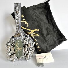 a black bag with some silver and white decorations on it