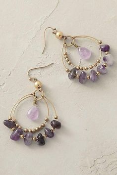 a pair of earrings with amethorate beads and gold filled earwires