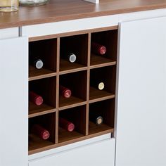 a wine rack with many bottles in it