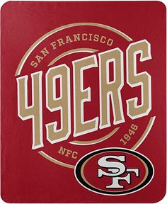 the san francisco 49ers logo is shown on a red towel with gold lettering and an image of