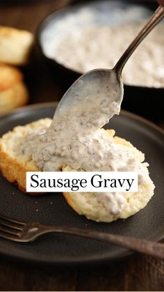 a spoon is being used to dip something in some kind of sauce on top of biscuits