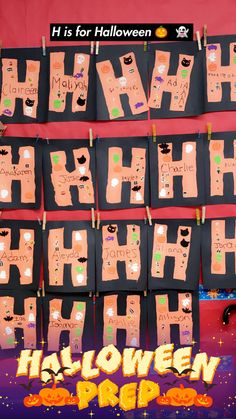 a bulletin board that has been decorated with halloween words and pictures on it, along with the words h is for hallowen