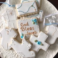 decorated cookies on a plate with the words god, bliss and jesus written on them